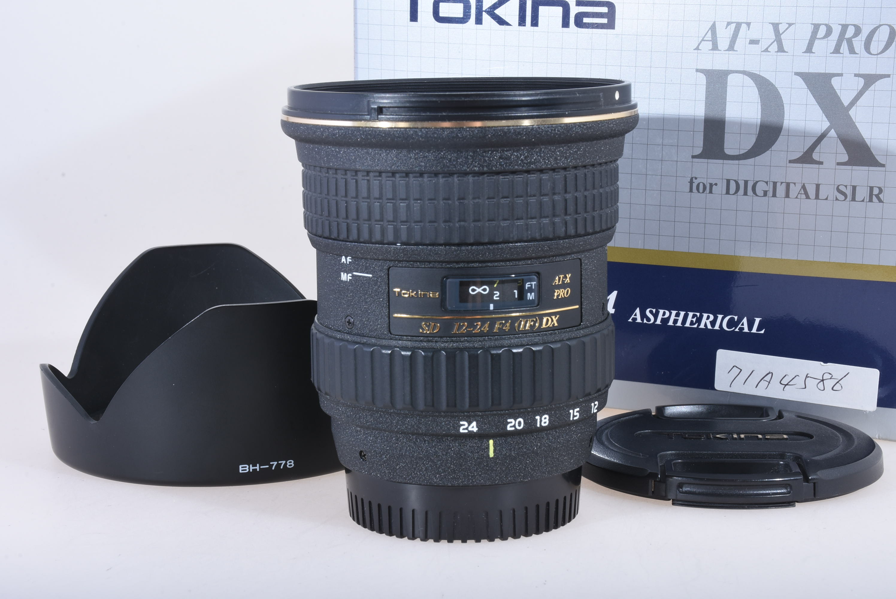 Tokina AF 12-24mm 4,0 für Nikon + Sonnenblende Bild 01